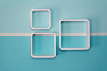 White wooden shelf hanging on the wall in the living room