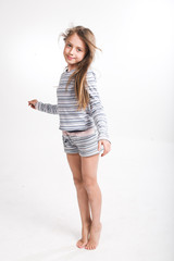 little girl jump over white background