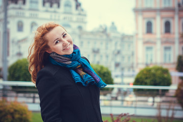 Life woman in european city, walks with good mood and have fun in park