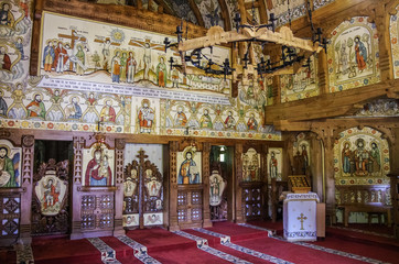 Fototapeta na wymiar Interior of wooden church of Barsana monastery. Maramures region, Romania