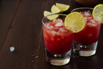 Red orange juice in glasses with ice