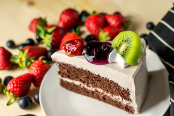 closeup delicious fresh dessert strawberry orange kiwi fruit with  white cream slice cake