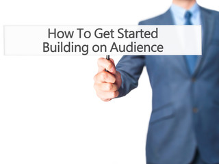 How To Get Started Building on Audience - Businessman hand holding sign