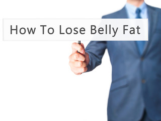 How To Lose Belly Fat - Businessman hand holding sign