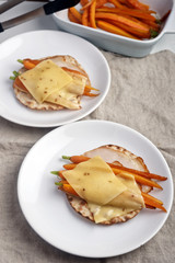 Sandwiches with ham, cheese, and roasted carrots