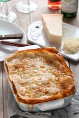 Lasagna Bolognese on a rustic table