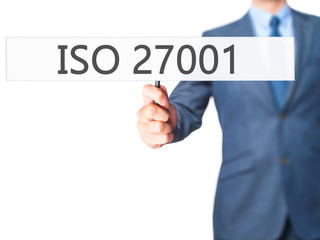 ISO 27001 - Businessman hand holding sign