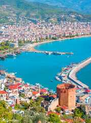 Landscape with marina and Kizil Kule tower in Alanya peninsula, Antalya district, Turkey