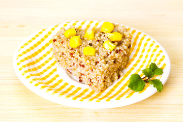 Quinoa salad with corn on yellow plate