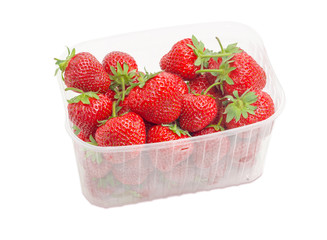 Garden strawberries in the plastic container