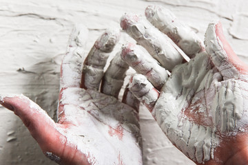 Obraz premium Hand White Plaster Closeup Repair Building Worker Dirty Stucco Construction Unrecognizable Concept