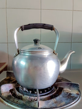 aluminium teapot boil on the old gas stove