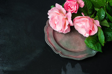 Summer table setting with roses