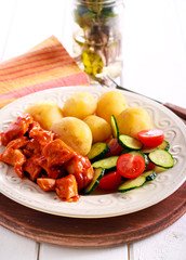 Chicken breast in tomato sauce with potato