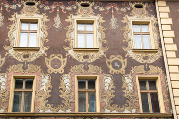 Six yellow vintage design windows on the facade of the old house