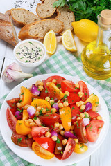 chickpeas, tomato salad vertical view from above