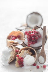 Obraz na płótnie Canvas ice cream in a waffle cone and berries