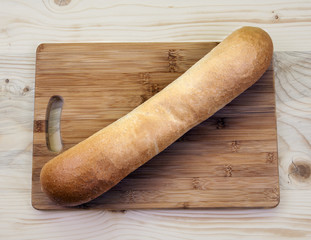 Whole loaf of bread - plain, natural and simple - long bread baton / French stick.