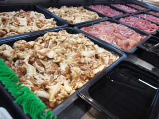 raw meat on showcase in supermarket