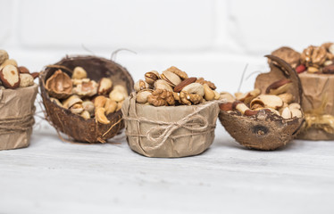 Fototapeta na wymiar different nuts in a plate closeup