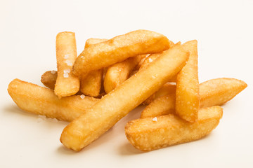 french fries with salt on white background