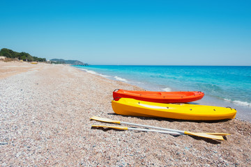 Two kayaks on sea edge