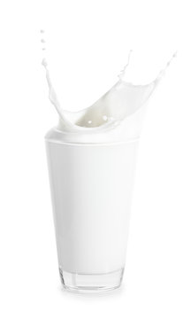 big glass of milk with splashes