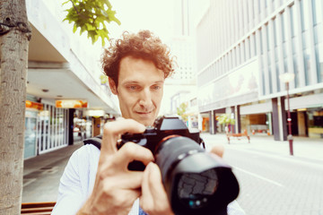 Male photographer taking picture