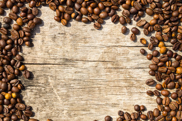 Coffee beans frame on grunge wooden background