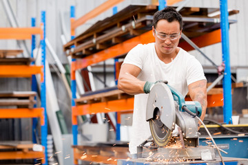 Asian worker in production plant on the factory floor