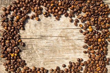 Coffee beans frame on grunge wooden background