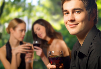 Young man with red wine