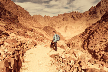 Woman Hiker with backpack enjoy view in desert