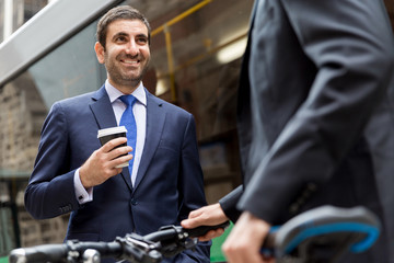 Young businessmen with a bike