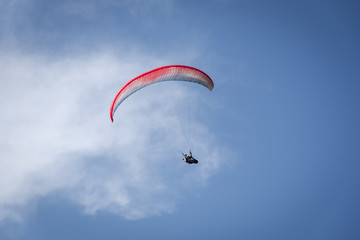 Paraglider in the blue sky