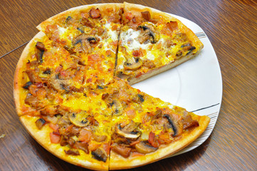 Delicious pizza on the table. Fresh baked pizza at home