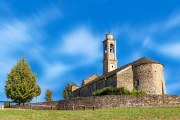 Fototapeta premium Old stone church under blue sky.