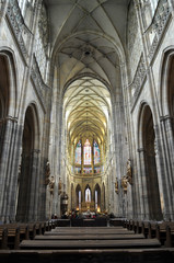 Obraz premium Interior of the gothic cathedral of St. Vitus in Prague. Symmetric vertical perspective view.