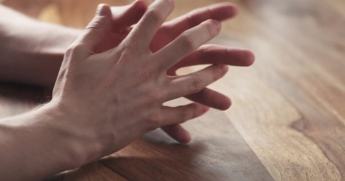 Young man hands waiting nervous at the table, 4k 60fps prores footage