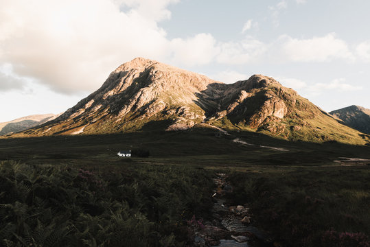Cabin in the scottish highlands at sunset