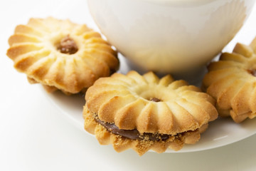Cookies close-up on a background of a cup of coffee