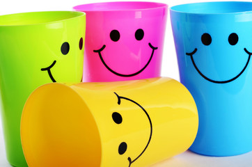 Plastic colorful cups close up