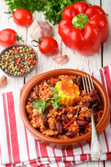 Homemade stewed spicy meat with beans, corn and spices. Chili con carne. A dish of Mexican cuisine. Selective focus