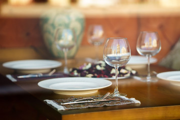 table for event with flower vases,towels and wine glasses