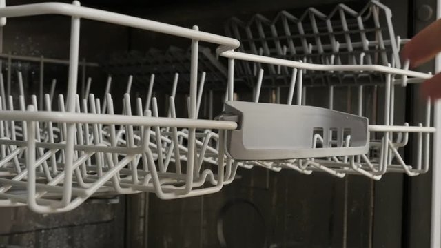 Interior of dish-washing machine trays slow motion 1920X1080 HD footage - Manual sliding automatic dishwasher racks slow-mo 1080p FullHD video