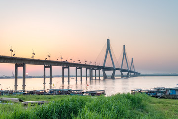 dongting lake bridge with setting sun