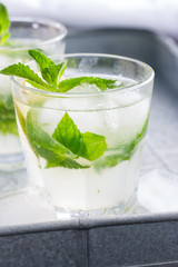 Cold refreshing non-alcoholic cocktail mojito in glass glasses, selective focus, close-up