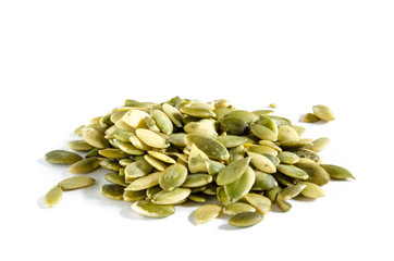 Heap of raw pumpkin seeds isolated on white