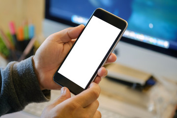 Man holding smart phone with blurred background.  For Graphic display montage.
