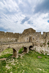 Fototapeta premium Second part of the Gate of Saint John, bridge leading to it and moat at Rhodes old town, Greece 